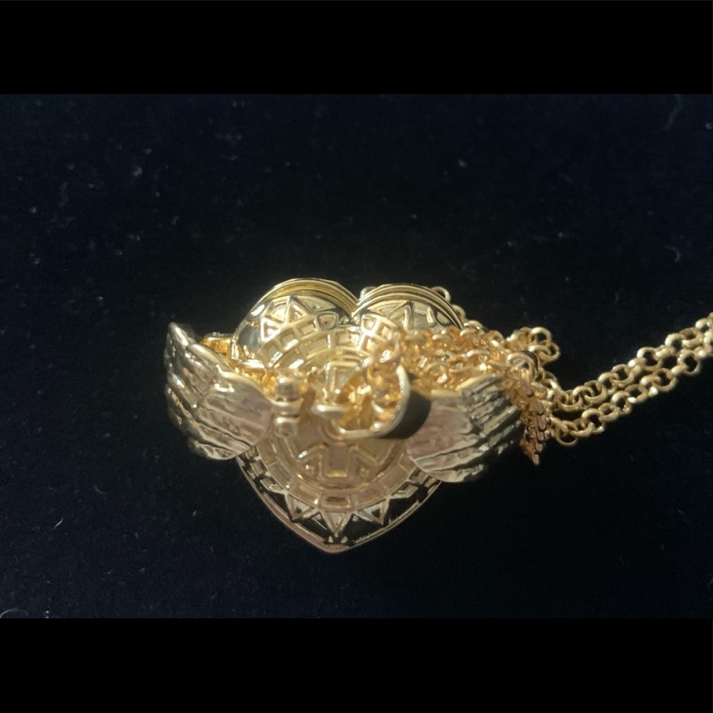 Gold Tone Angel Wings Heart Shaped Ball PHOTO LOCKET. Holds 8 pictures.New